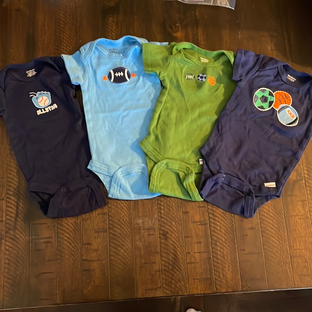 Set of 4 boy's onesies with sports themes, size 0-3 mo.